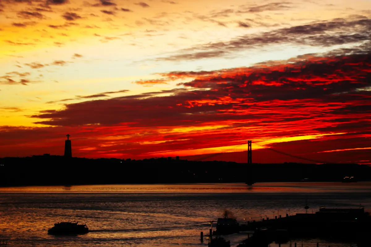 An amazing red winter sunset with the 25 de Abril bridge in the background